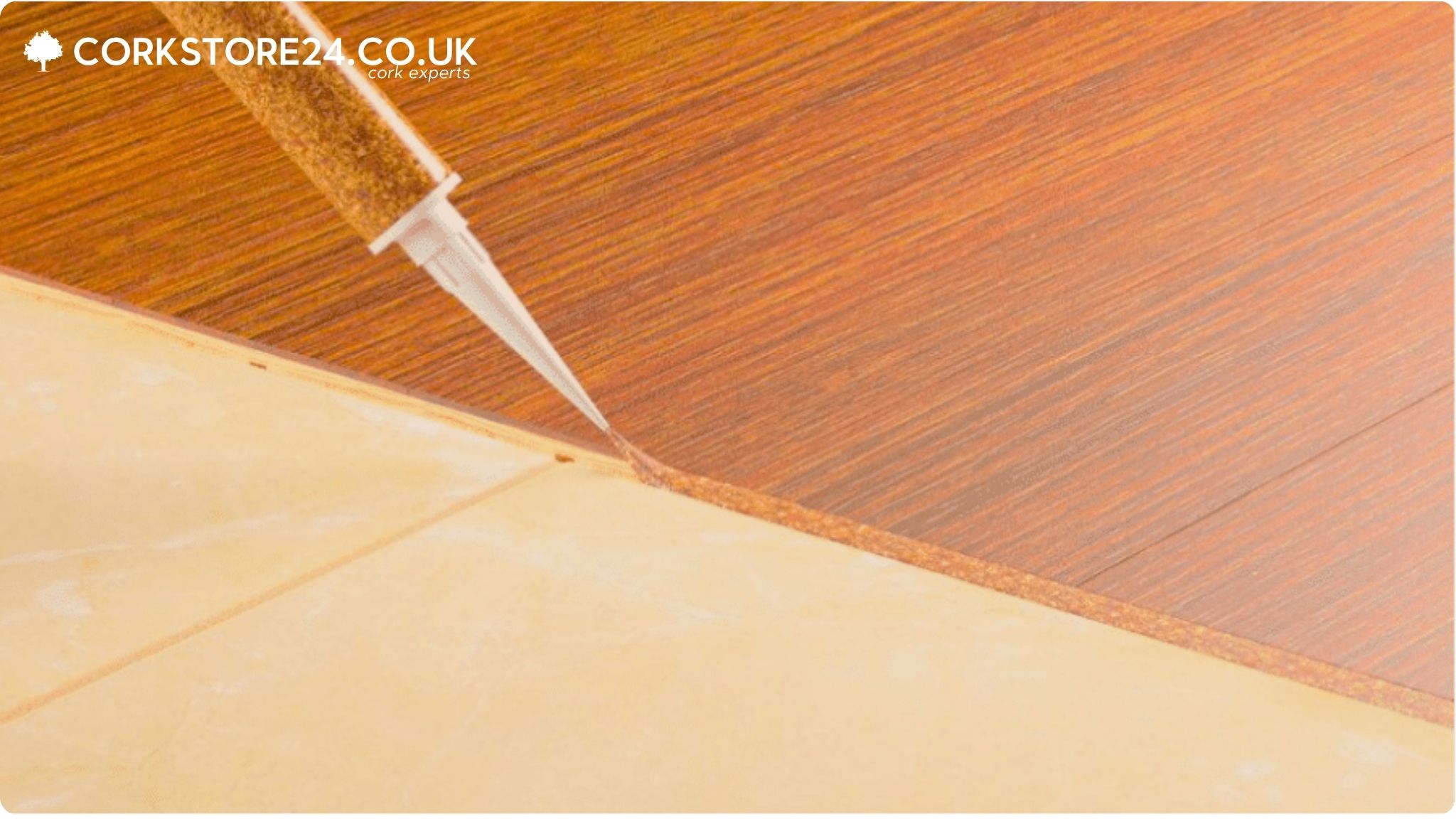Floor sealant applied between tiles with a tube of liquid cork.