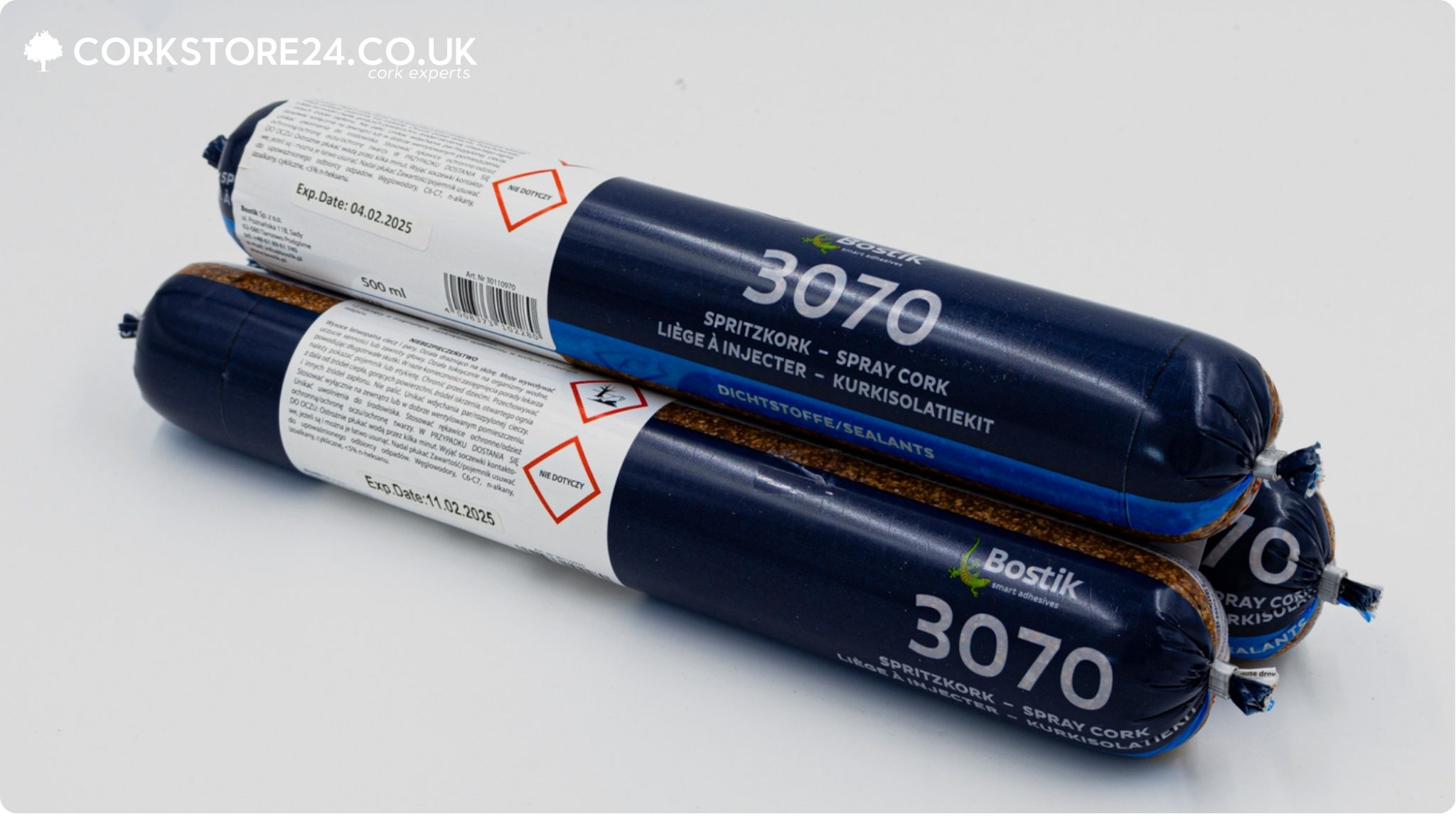 Two tubes of adhesive with blue and white labels, branded Bostik 3070. One of the tubes is opened, revealing the cork inside.